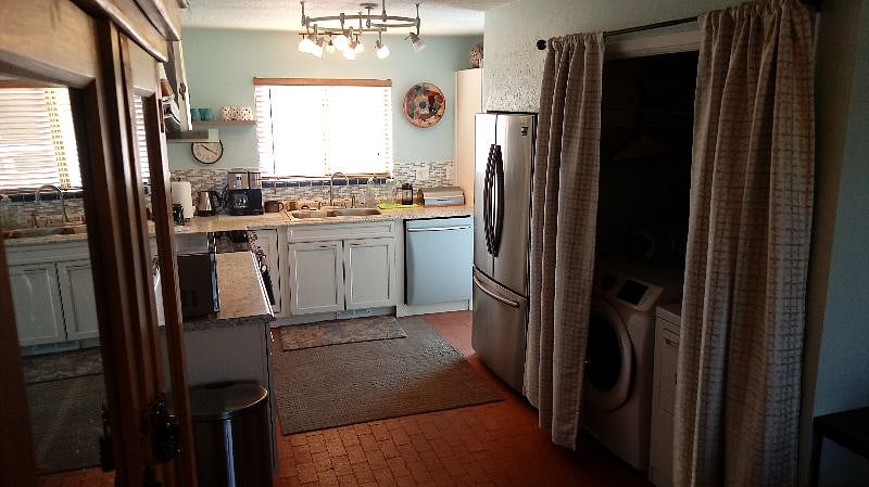 Washer and Dryer hidden away behind the curtains
