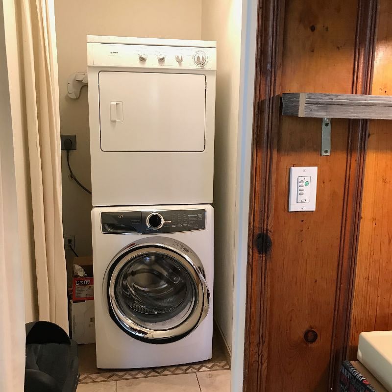 Stackable Laundry w/Limited Supplies right outside Kitchen in Hallway to Master Bedroom.