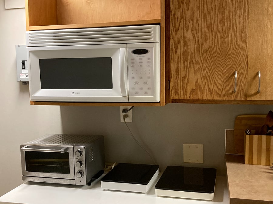 Microwave, toaster oven (regular toaster in cabinet), two induction cooktops and induction-usable pots and pans.
