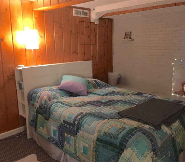 Your sleeping alcove has an excellent double bed mattress, a headboard with storage and a decorative (nonfunctional) fireplace with a room length seating ledge, and personal heater (if needed).