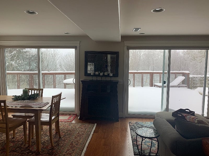 Occasionally we get snow in the winter! View from the apartment out to the snow-covered deck and trees.