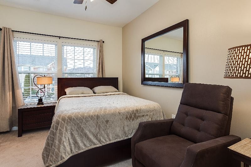 Suite 1 with en-suite bath, walk in closet, smart TV, and smart-lock suite door.
