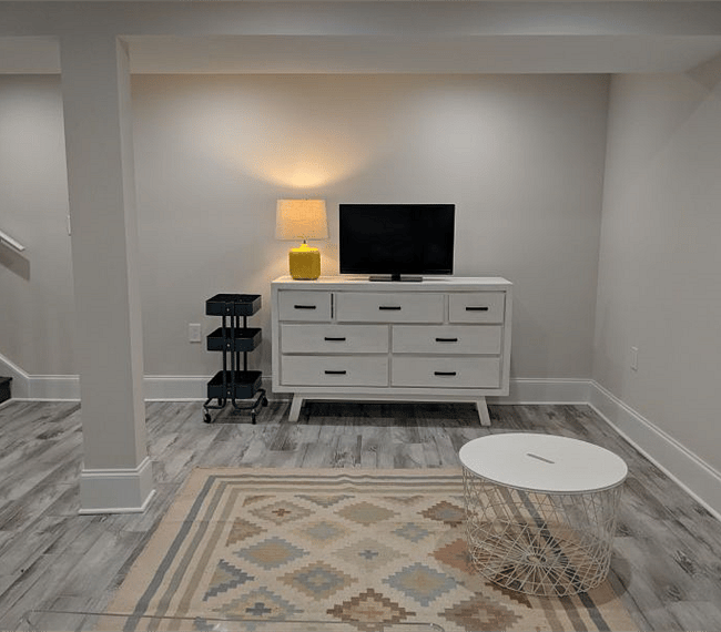 Living room, smart TV with YoutubeTV providing all basic cable and local channels and DVR.