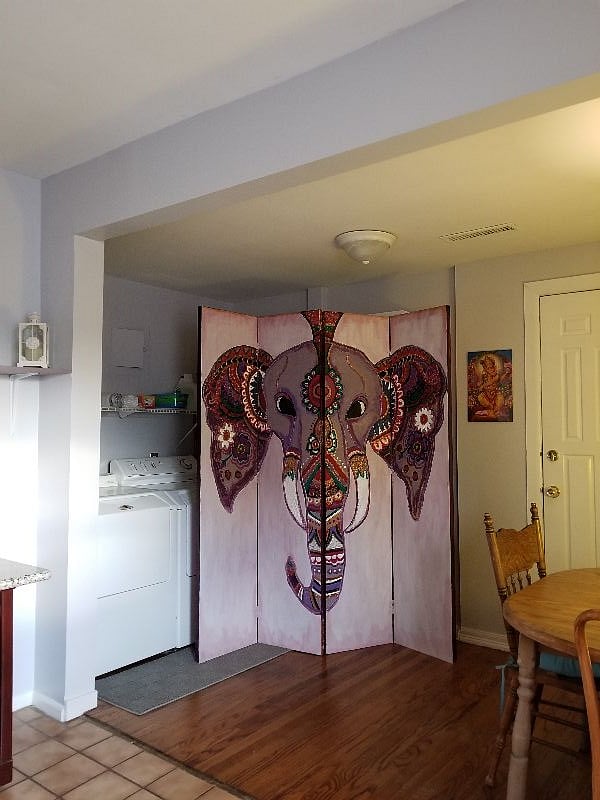 This is the laundry room and back entrance to deck and stairway of upstairs apartment.