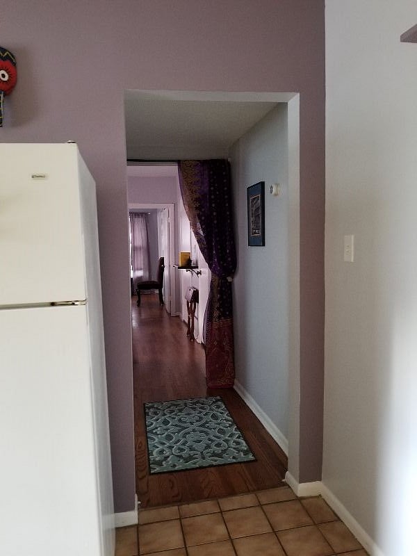 This is part of kitchen & hallway to living room, bedroom, bath & interior stairway of upstairs unit.