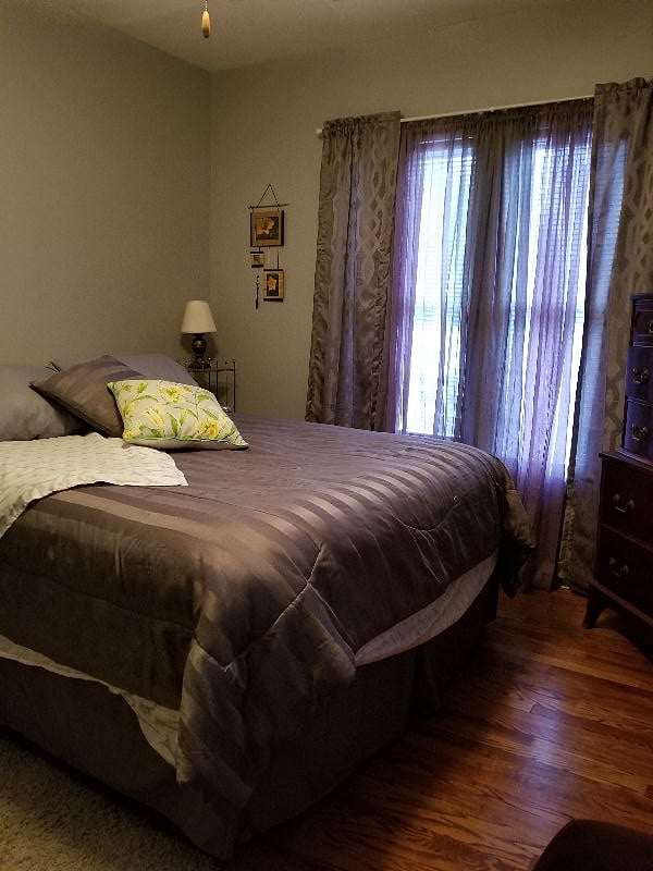 This is bedroom with queen bed of upstairs unit.