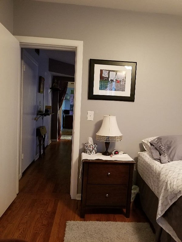Bedroom and hall to living room & kitchen of upstairs unit.