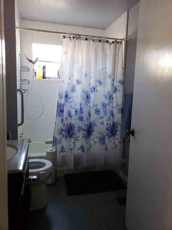 This is bathroom of downstairs unit. Both units have tubs & showers with bidets on toilets.