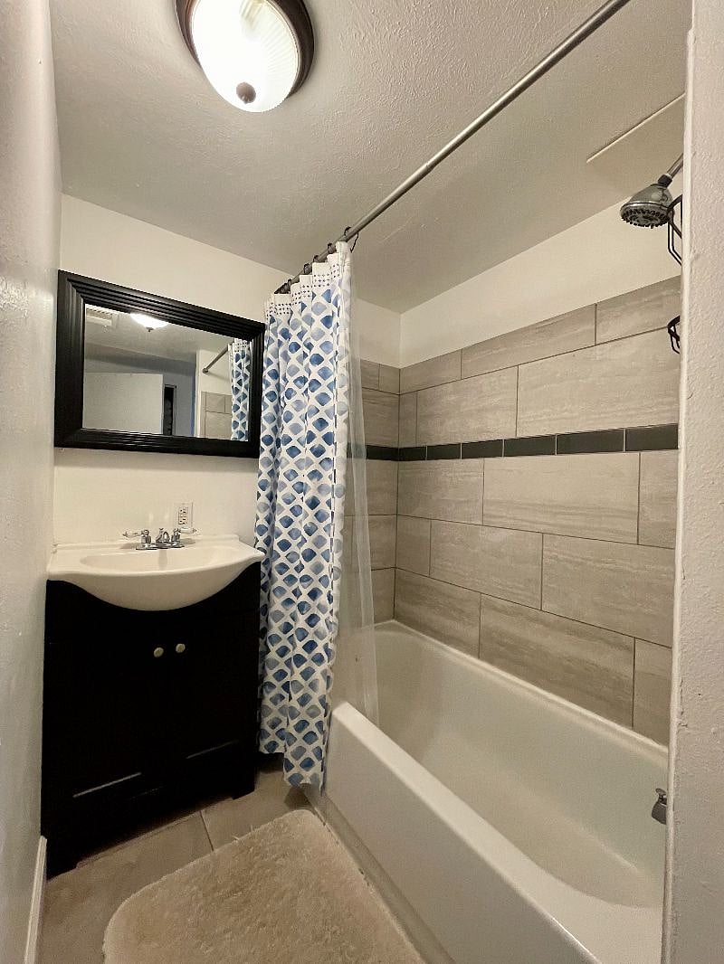 Full bathroom with storage closet