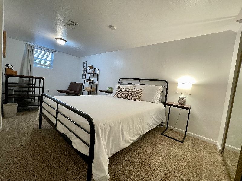 Larger of the two bedrooms with a dedicated desk space. Queen size bed. Oversized closet with dresser for extra storage. 