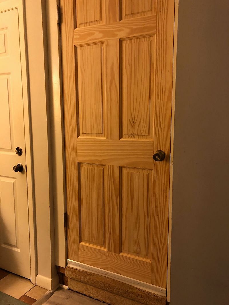 Left door leads to laundry and garage. Right door is locked door between main house and apartment.