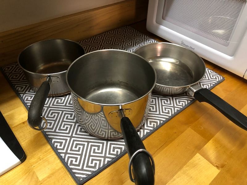 Pots and pans provided for use with hot plate.