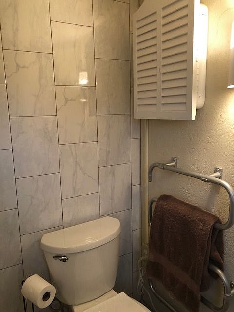 Heated towel bar in bath