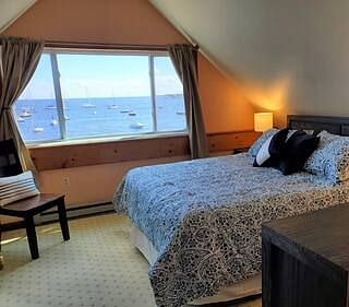 Master bedroom with an ocean view. Queen size bed, full dresser, 2 bed-side tables and large closet.