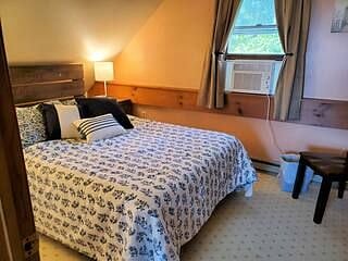 Spare bedroom. Full size bed, 2 bed-side tables, large closet with full dresser.