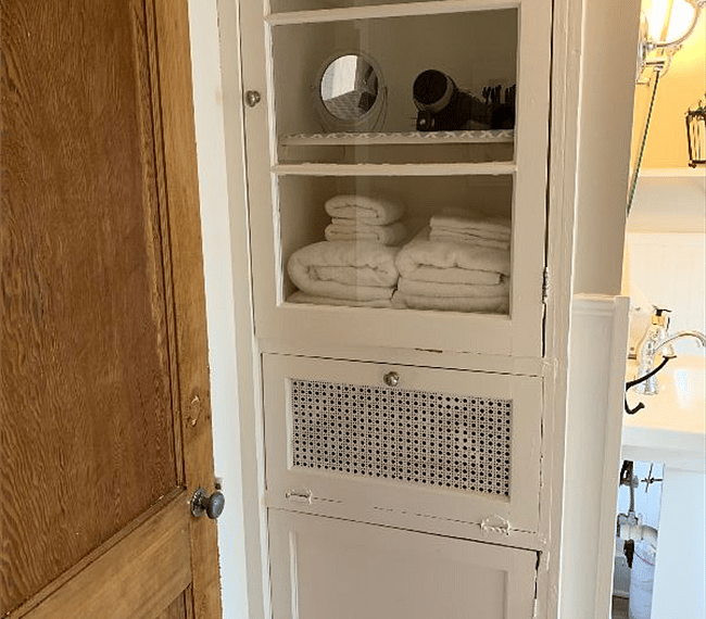 Storage in Bathroom with a combo washer/dryer unit included