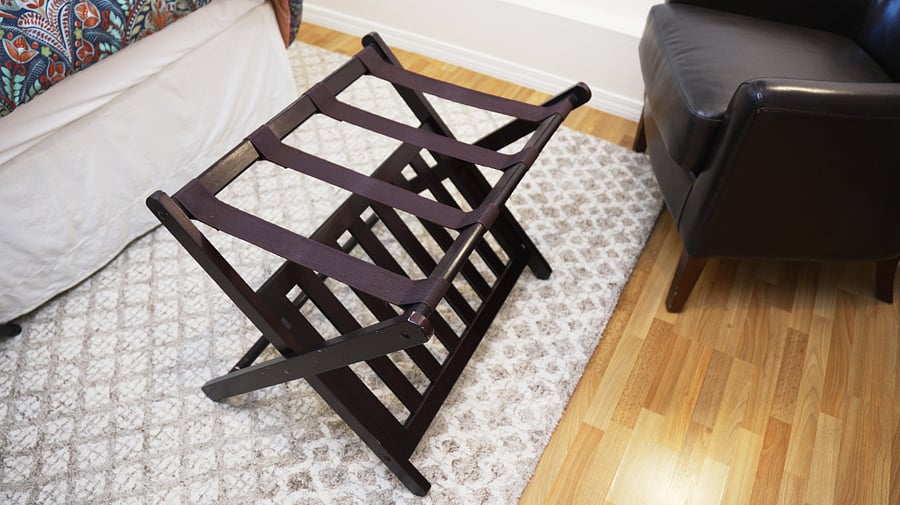 A luggage rack in each room.