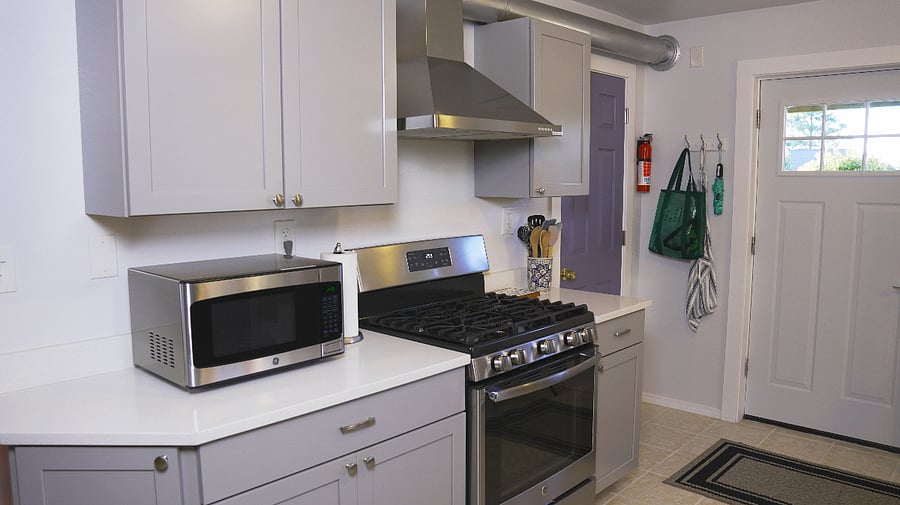 A 5-burner gas stove and a cooking range.