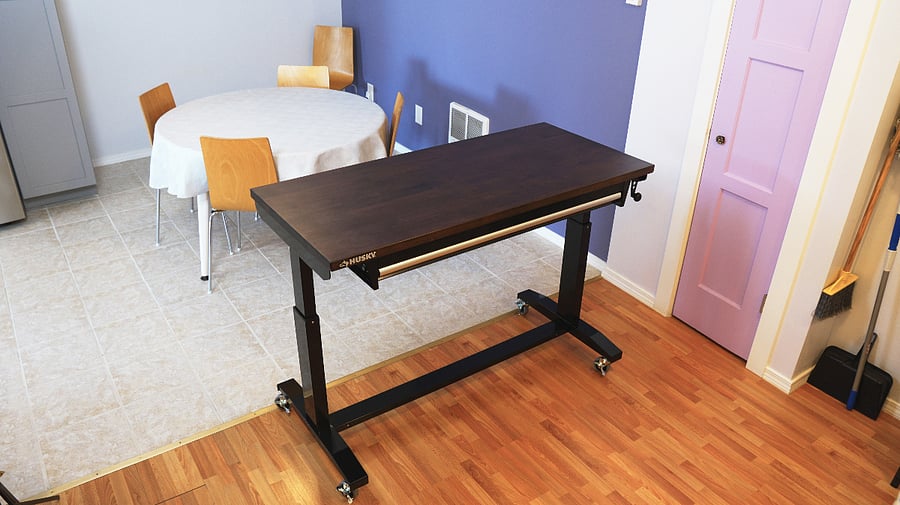 New adjustable table with rollers. Makes for a portable work station, or game table.