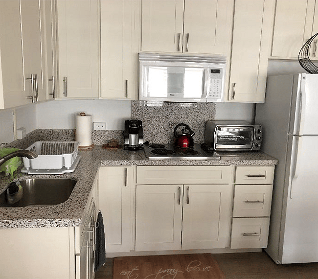 recently remodeled, kitchen, keurig, toaster oven, stove and cupboards filled with all you need to cook and eat at home or out.  