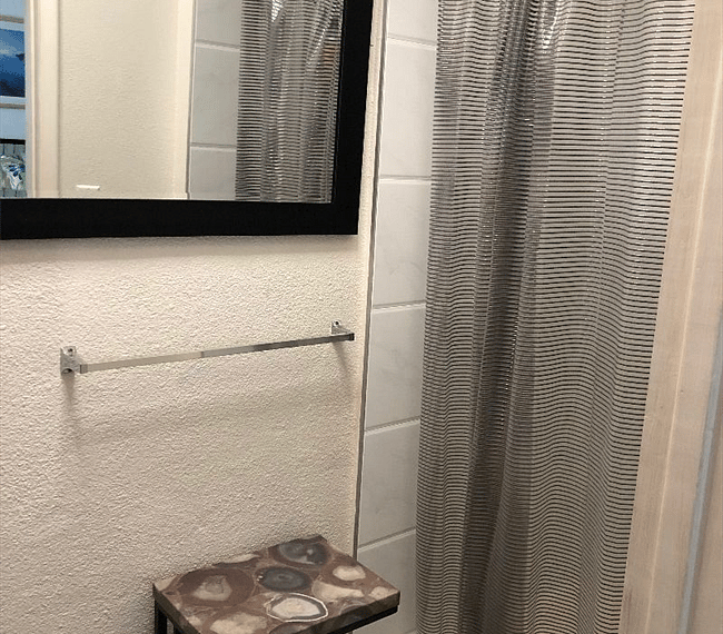 Shower room with fan, blue light and bluetooth to sync your music while you shower! 