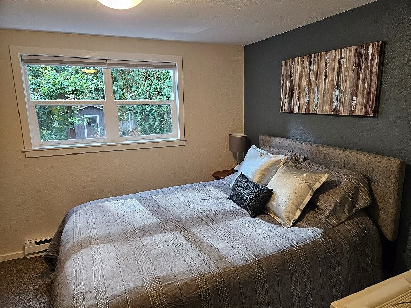 Queen size bed and blackout curtains.