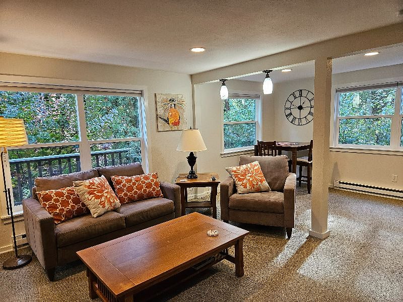 Sweet living space with views of gardens.
