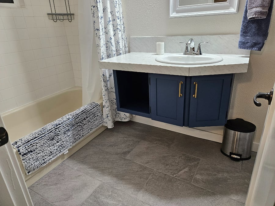 Heated tile flooring and full size bathtub.