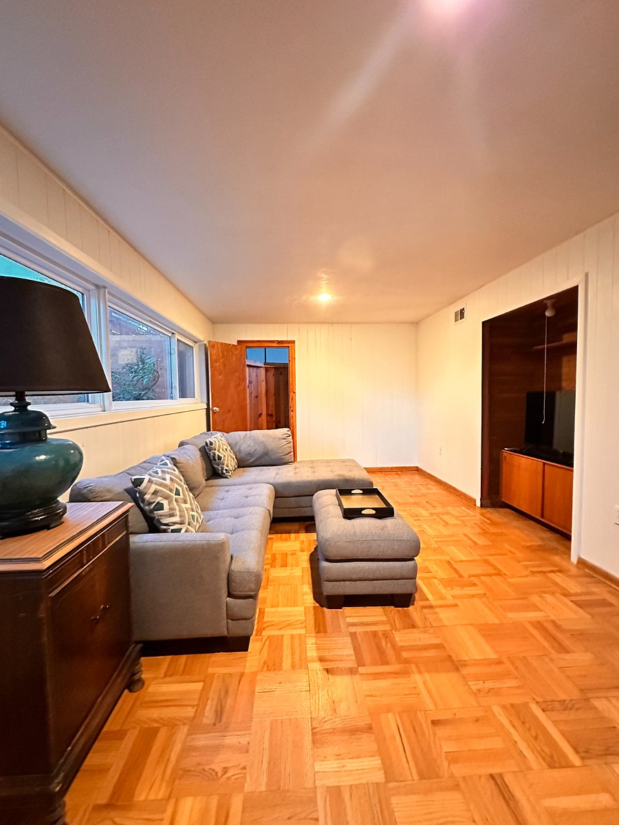 View across den to Master Bedroom, up half-flight of stairs through doorway