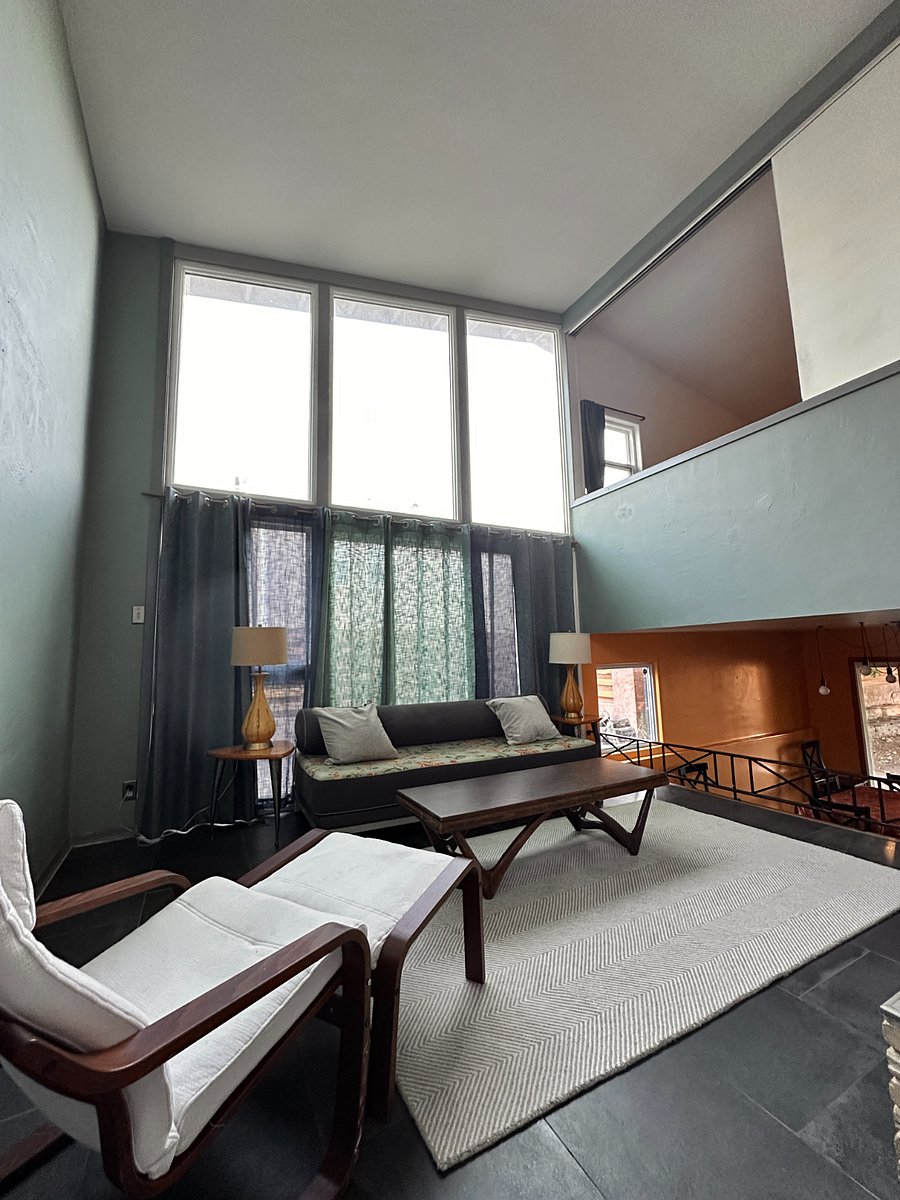 Mid-level living room with loft above