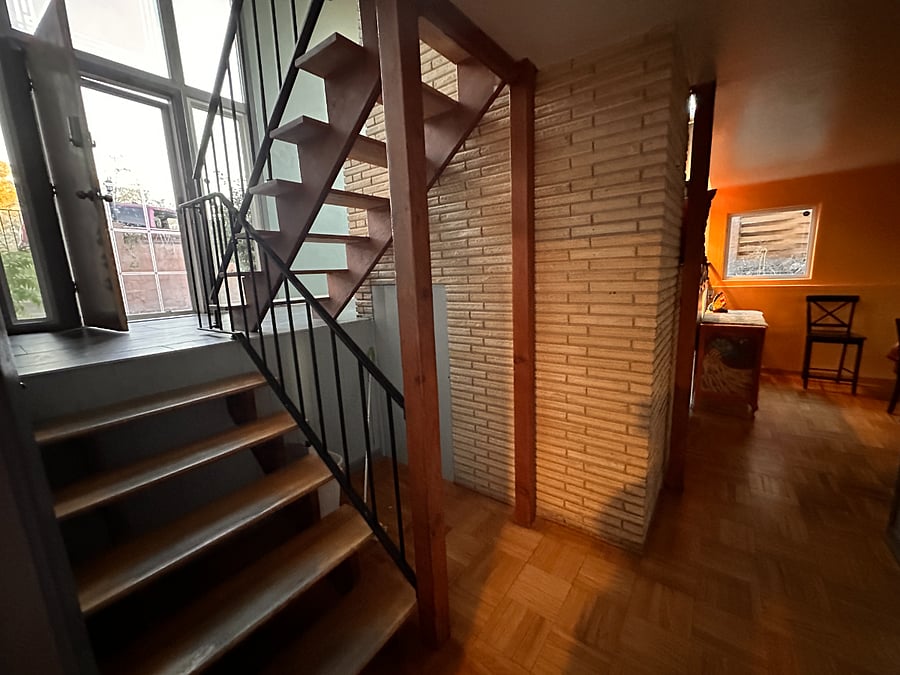 View from the bottom of the stairs, looking toward dining room
