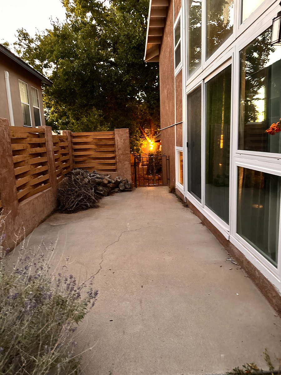 Side patio walkway from front of the house to backyard
