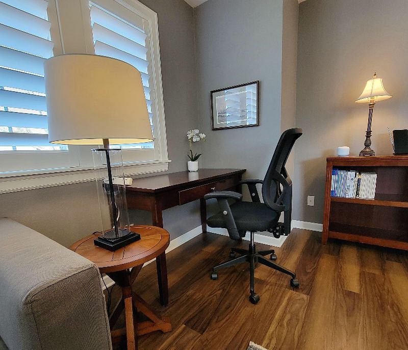 Desk area detail. Internet is included, power strip provided. Room for a laptop and keyboard.