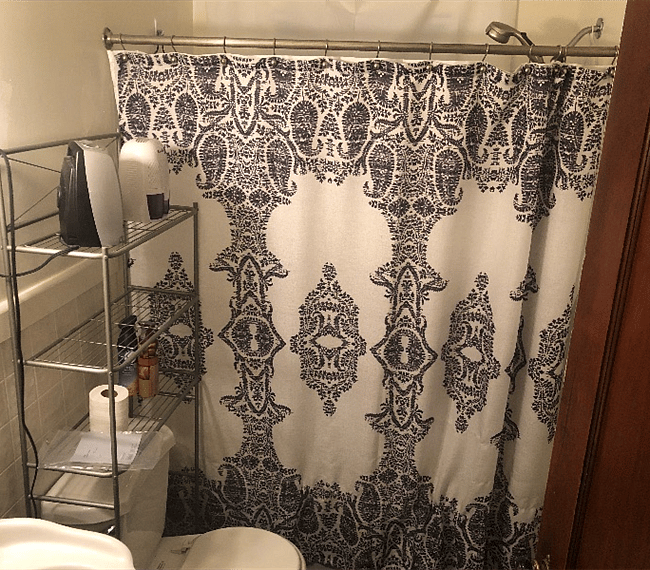 Main floor bathroom with plenty of storage space! There are cabinets and drawers across from the toilet, and towel hanging space in a narrow cabinet or the back of the door. 
