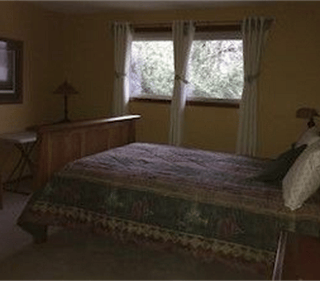 bed with winter comforter, 
new black-out curtains 