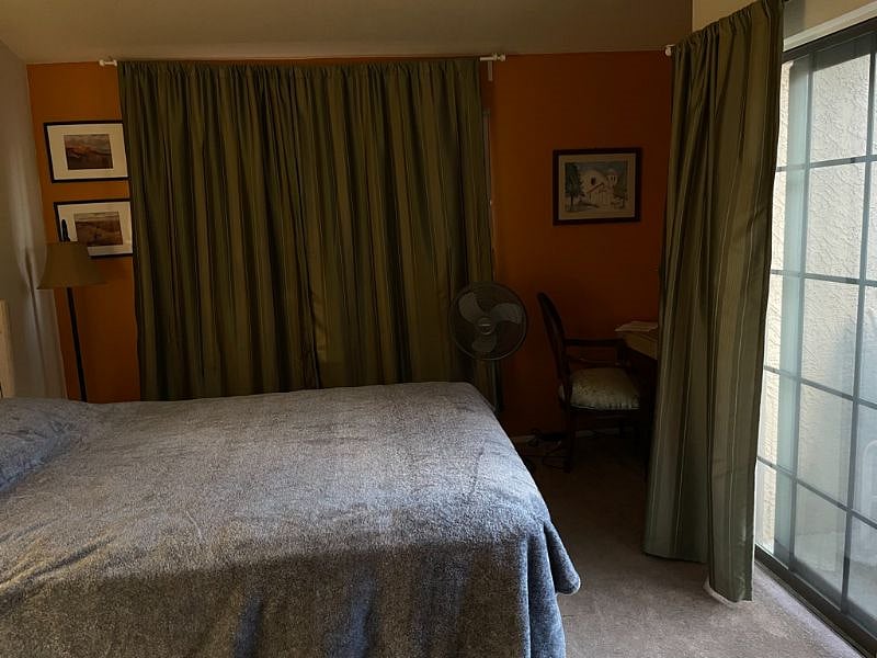 Bedroom showing the balcony and desk