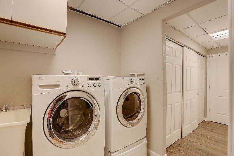 Laundry Room with Full Size Washer and Dryer, and Utility Sink