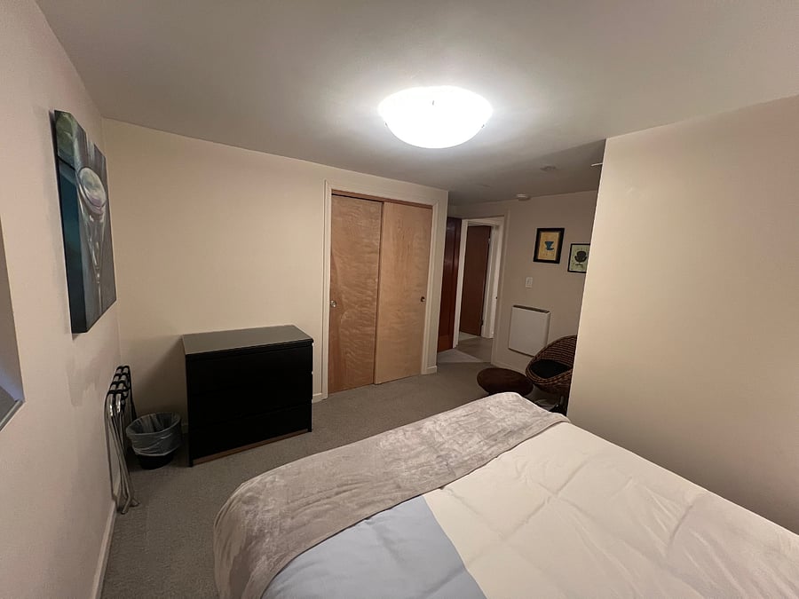 Guest bed with Closet with luggage rack, hangers and 3 drawer dresser