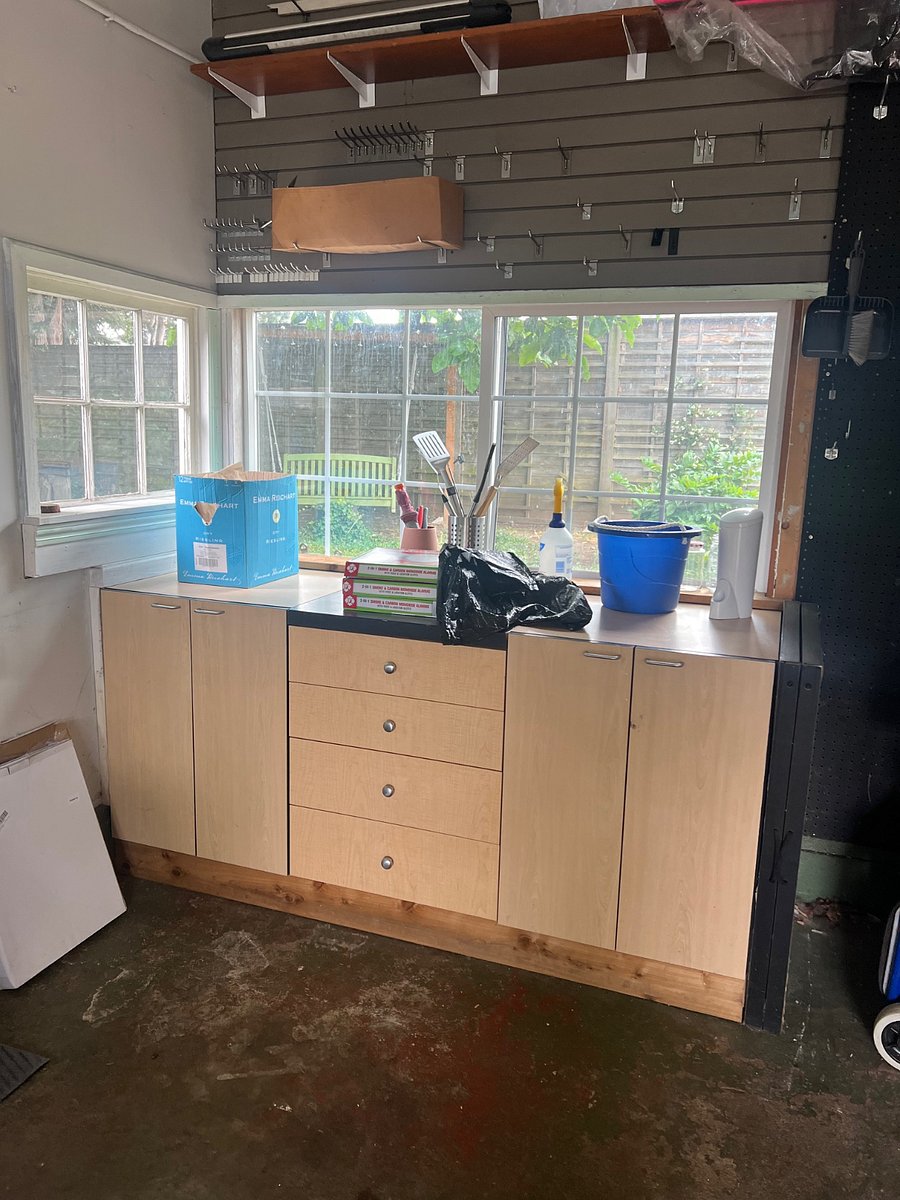 Counter surface in garage for guests use.
