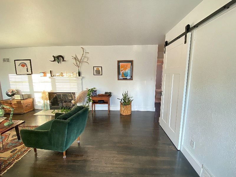Living room to the left, bedrooms and bathroom to the right.