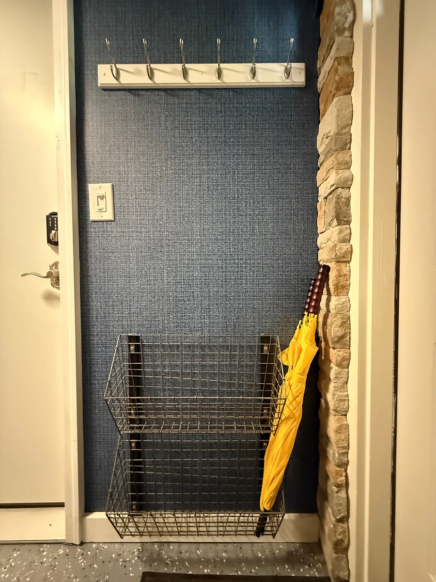 Once you enter, there is a coat rack and shoe holder to your right as you enter.