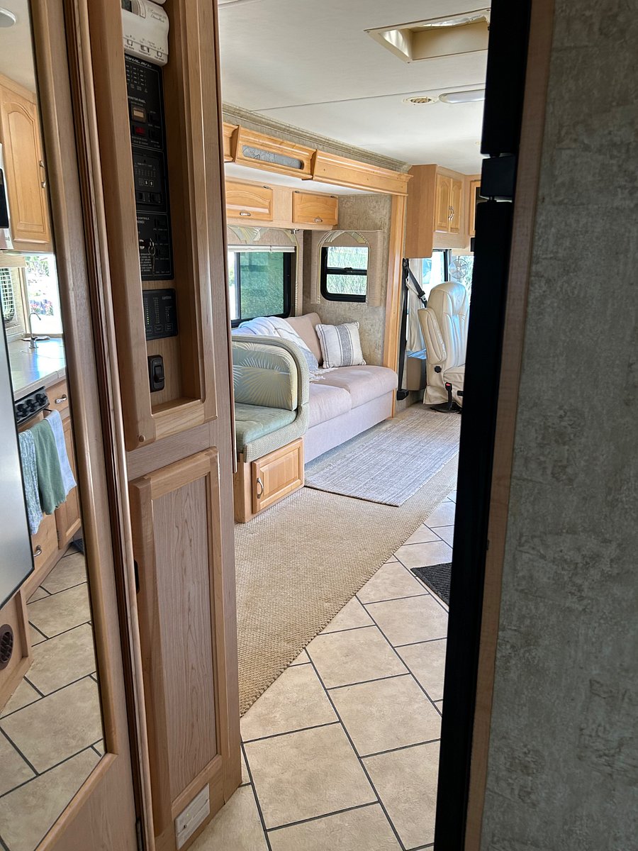 View of LR from nice-sized hallway with double closet & entry to the bathroom. Door to completely close off the living area