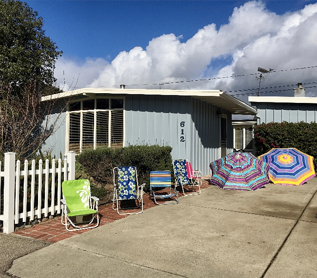 Front of house and unit is to the right with separate entrance