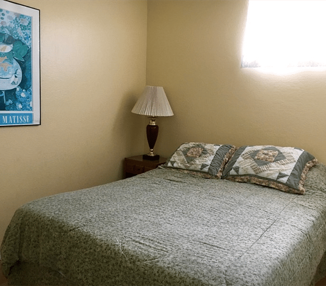 Queen size bed in bedroom