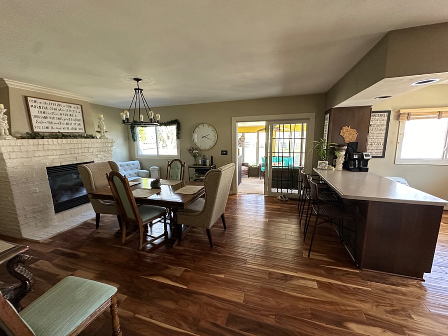 Dining Room, Kitchen Island Counter, Fireplace, and door to Three Season Room