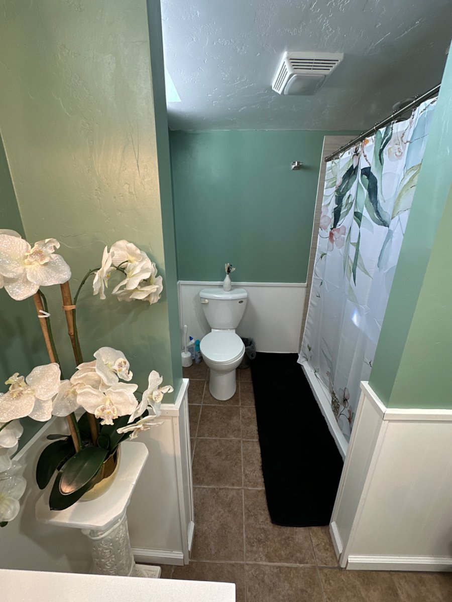 Private Bathroom, Floor Pan Shower, Basement, Renovated in 2023, Assigned to "Elegant Room"