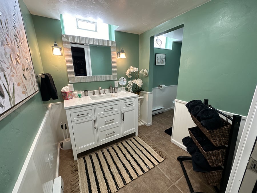 Private Bathroom, Floor Pan Shower, Basement, Renovated in 2023, Assigned to "Elegant Room"
