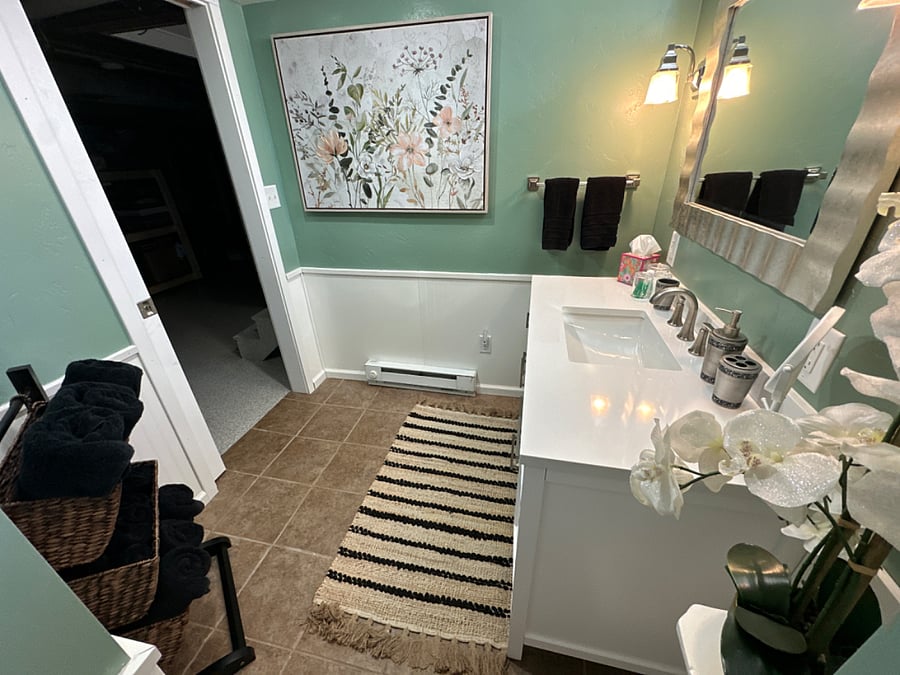 Private Bathroom, Floor Pan Shower, Basement, Renovated in 2023, Assigned to "Elegant Room"