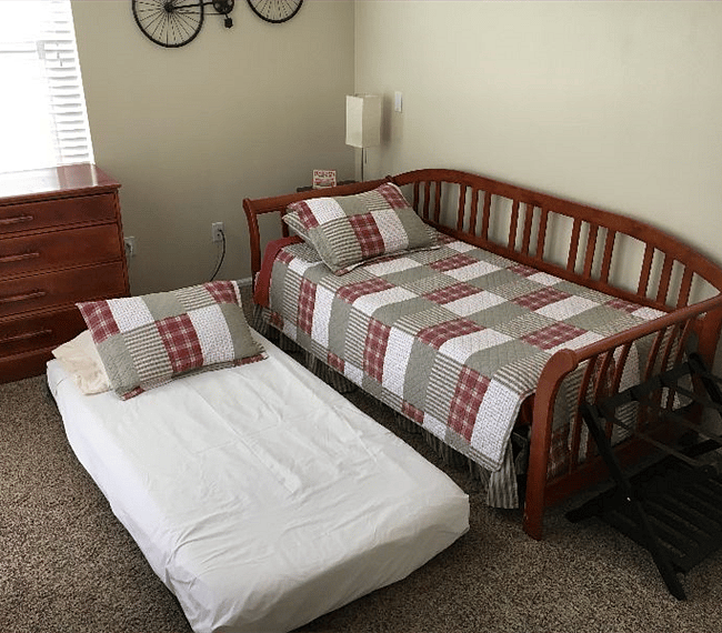 Two twin mattresses. No closet in this room. Guests can use hallway closet for storage. There is no longer any carpet in this room.
