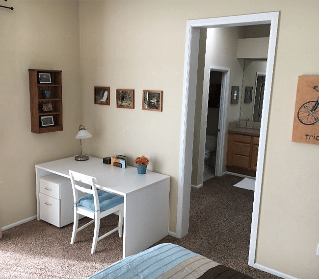 Bathroom is connected to bedroom.  There is no longer any carpet in the bathroom.  It was replaced by luxury vinyl plank as seen in following photos.
